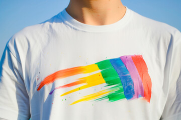 t-shirt with a hand-painted rainbow flag. Gay Pride Day Party. Symbol of the LGTBI community
