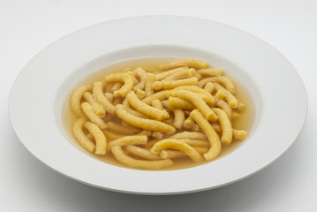 Italian Passatelli. Traditional Italian pasta cooked in broth. Bologna, Italy.