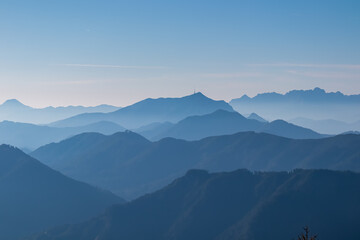 Panoramic view of magical mountain peaks of Karawanks and Julian Alps seen from Goldeck, Latschur...