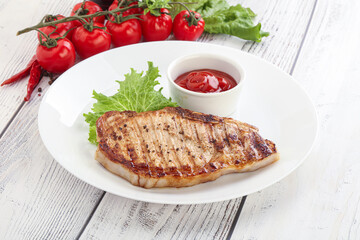 Grilled pork steak with ketchup
