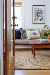 Entryway with a textured bench and classic modern elements