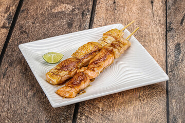 Grilled salmon skewer with sauce