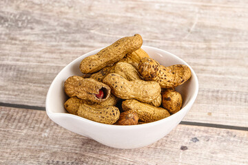 Raw ripe unpeeled peanut heap