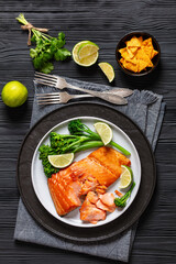 hot smoked salmon with cooked broccoli and lime