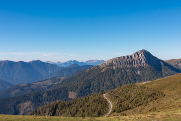 Panoramic view of rugged mountain peak Staff seen from Goldeck, Latschur group, Gailtal Alps, Carintha, Austria. High alpine road in Austrian Alps. Unique ridge surrounded by alpine forest