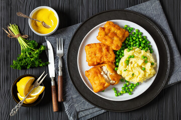 fried fish with mashed potatoes and green peas
