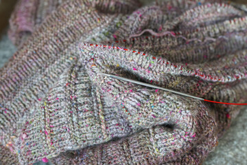 Beautiful handknit sweater, cardigan work in progress and on round knitting needles, made with pure...