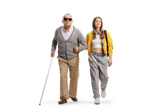 Female tenage student helping a blind man