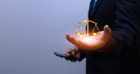 Hands of a businessman or lawyer with legal services icons For online legal advice on labor law for...