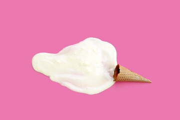 Melting ice cream with waffle cone on pink background.