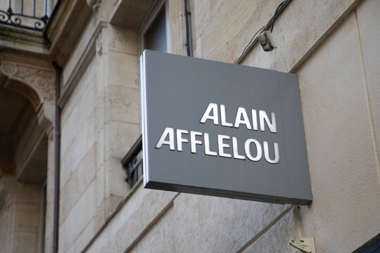 alain afflelou text sign shop and brand logo storefront facade wall entrance of medic store chain french Optician medical glasses