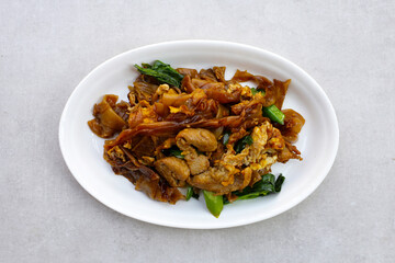 Stir-fried rice noodles with soy sauce and pork