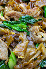 Stir-fried rice noodles with soy sauce and pork