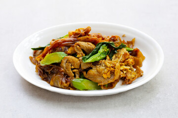 Stir-fried rice noodles with soy sauce and pork