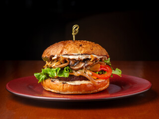 Burger, sandwich, hamburger with meat cutlet, mushrooms, onions, cheese and tomato.