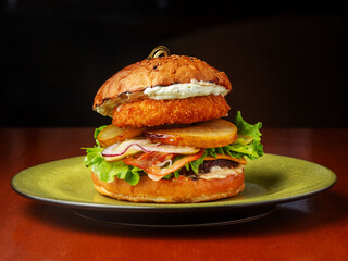 Burger, sandwich, hamburger with meat cutlet, cucumber, tomato and pear.