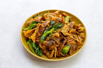 Stir-fried rice noodles with soy sauce and pork