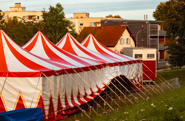 Summer view with a red and white circus tent at Landau, Isar, Bavaria, Germany