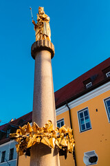 Summer view with a St. Mary's column at Landau, Isar, Bavaria, Germany