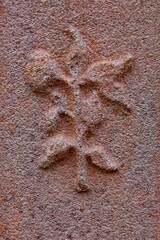 Gravestone engraving of flora.
