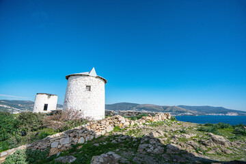 Fototapeta premium The windmills of Bodrum are a collection of stone buildings that were constructed in the 18th century and were used to grind grain into flour located on the hills between Bodrum and Gumbet, Yalikavak