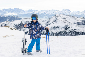 Fototapeta na wymiar Children and adults, happy family in winter clothing at ski vacation, skiing, winter