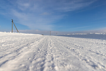 winter road after snowfall in sunny weather