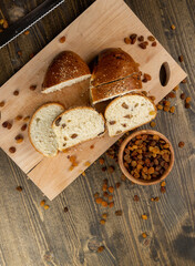 sweet bun with golden raisins, closeup