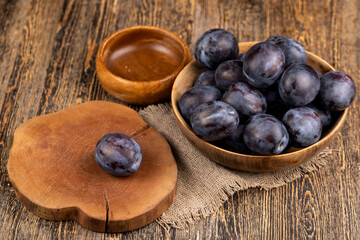 delicious fresh harvest plum oval shape and purple color