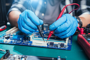 The technician repairing the computer. the concept of computer, CPU, motherboard, hardware,...