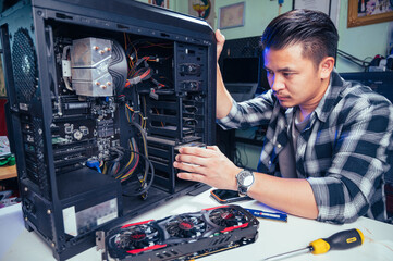 The technician repairing the computer. the concept of computer, CPU, motherboard, hardware,...