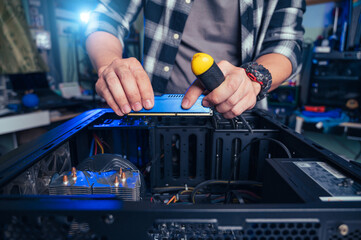 The technician repairing the computer. the concept of computer, CPU, motherboard, hardware,...