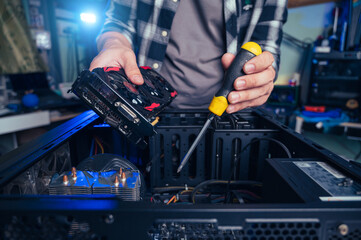 The technician repairing the computer. the concept of computer, CPU, motherboard, hardware,...