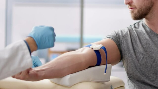 Patient Blood Draw By Doctor. People Donate