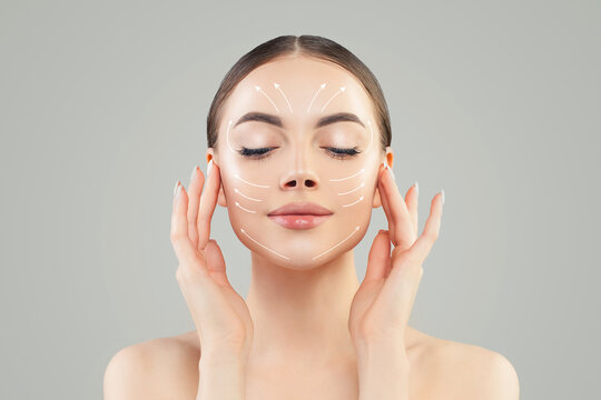 Massage facial lines on beautiful female face close up