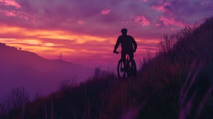 Adventure Sports: Mountain biker on a trail at dawn