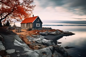 Foto op Aluminium a house on a rocky shore © Adelina