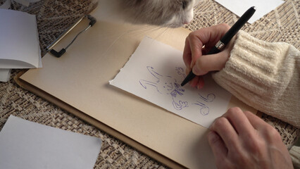 Hand drawing a rabbit. Easter gift.