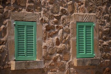 bright green window shutters of a traditional spanish finca