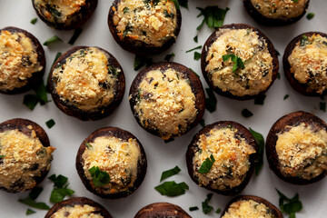 Homemade Garlic Parmesan-Stuffed Mushrooms on a plate, top view. Close-up.