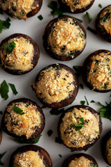 Homemade Garlic Parmesan-Stuffed Mushrooms on a plate, top view. Close-up.