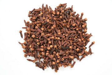 freshly dried organic clove spice texture close up. top view on white background. Isolated Clove buds.