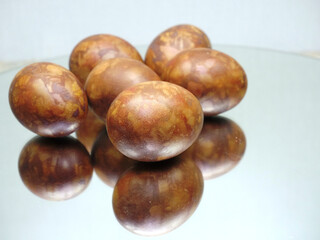 Red colored Easter eggs with marble pattern isolated on white background