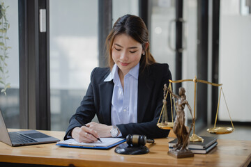 Concepts of Law and Legal services. Lawyer asian woman working at law office.