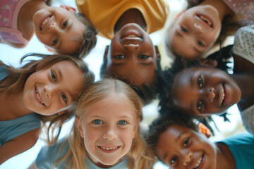Portrait of cheerful multiracial kids looking into camera and smiling. Children of different skin color, view from below. - obrazy, fototapety, plakaty