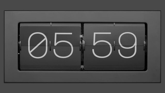 Flip clock quickly flips. Retro flip clock changing from 05:59 to 06:00.. Slow motion. Close up. 