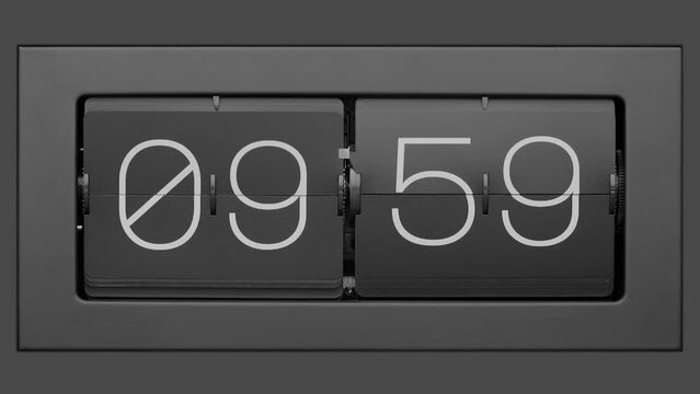 Flip clock quickly flips. Retro flip clock changing from 09:59 to 10:00.. Slow motion. Close up. 
