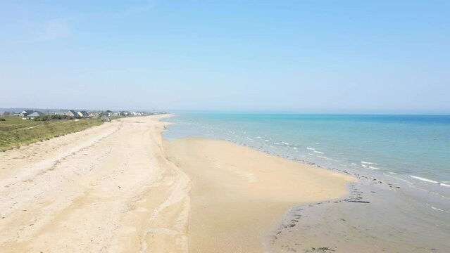 The fine sand of Utah beach facing the English Channel in Europe, France, Normandy, towards Carentan, in spring, on a sunny day.
