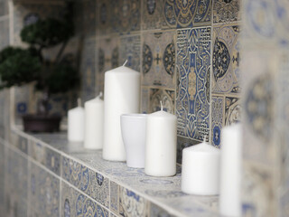 Candles on the wall in bathroom. Selective focus