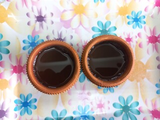 Green tea in clay cup, hot tea clay payali in winter,Desi mud cup of tea in winter Morning, 
Pair of mud cups of tea,Hot tea in winter,close up view of Indian two Mud tea cup in the color background 